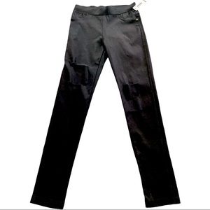 Brand new  Medium Jeggings with tares. Dark black. I lightened in picture